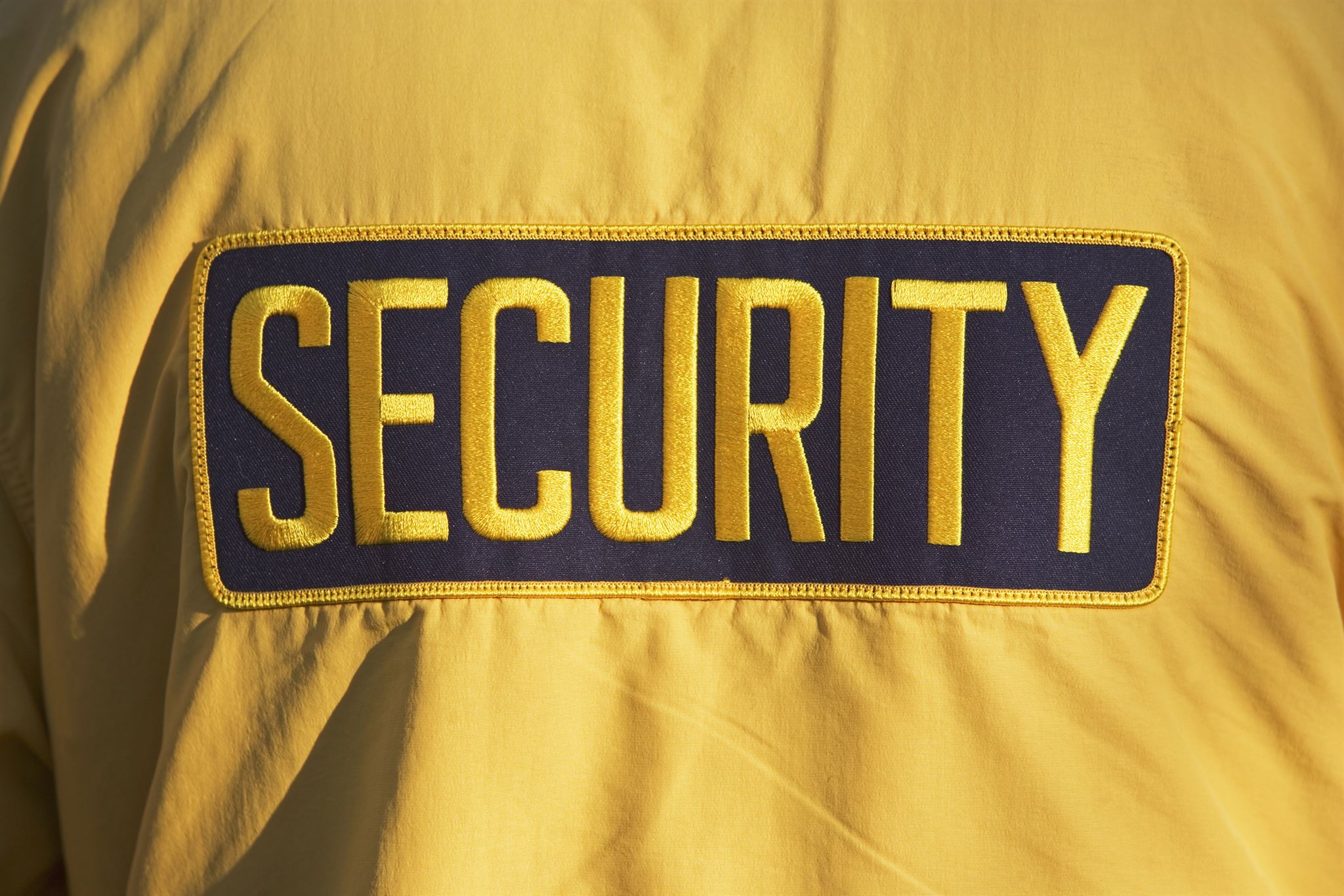 Black-and-yellow-security-logo