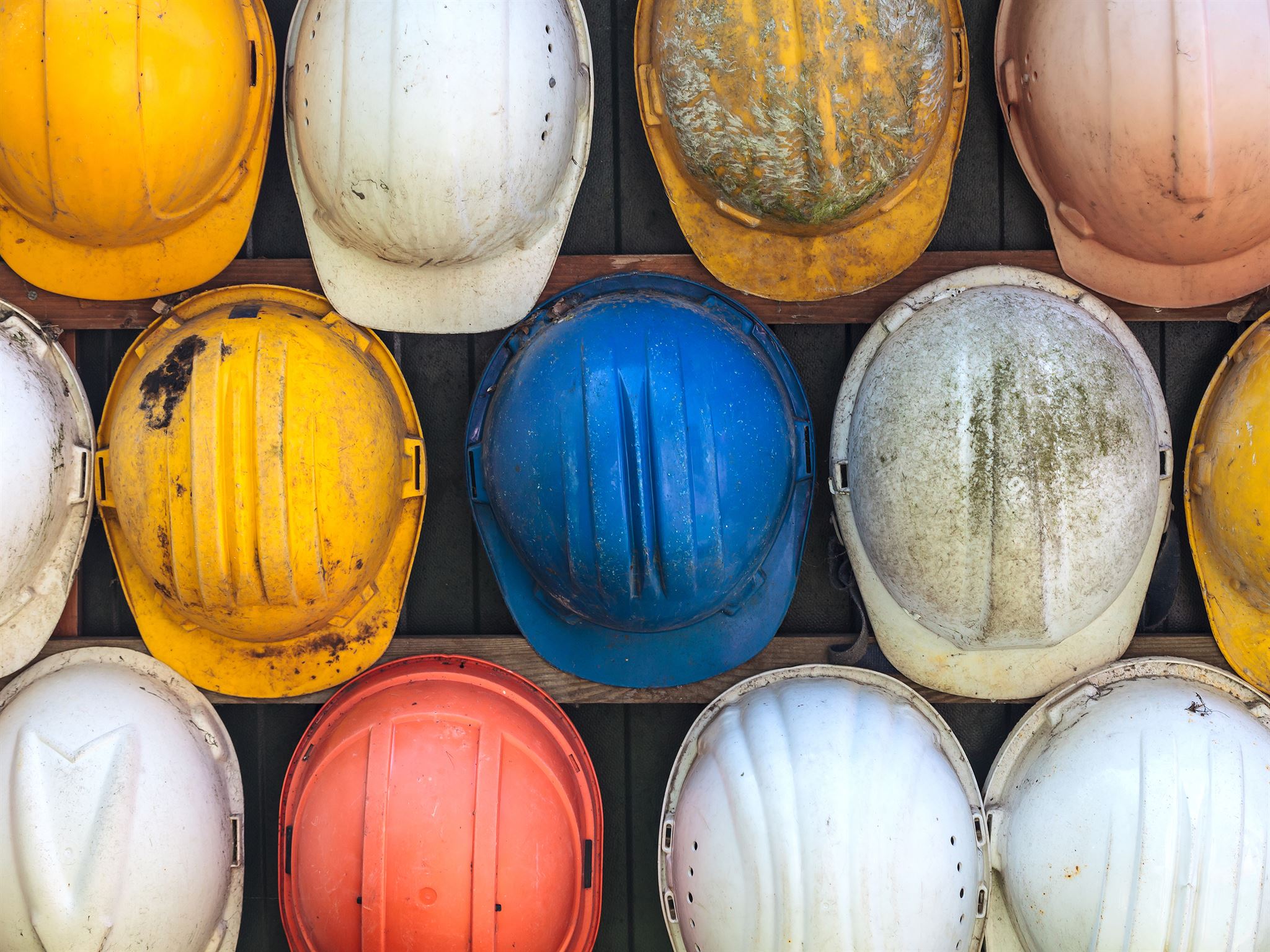 Colorful-hard-hats-on-wall